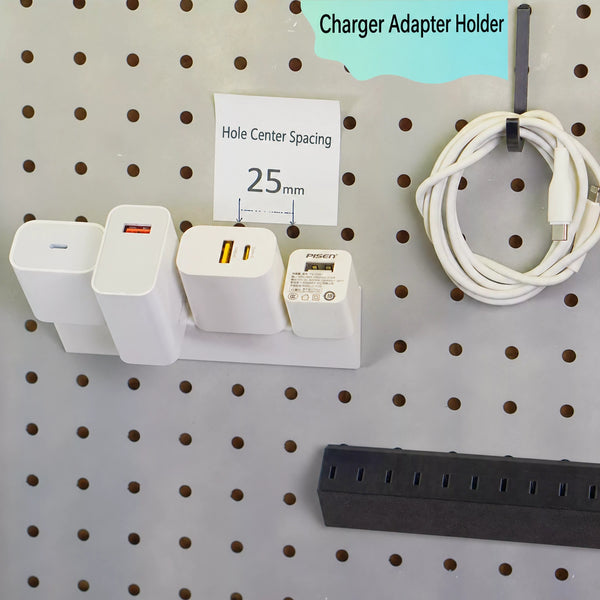 Four USB charging adapters stored on a white pegboard holder with a 25 mm hole center spacing label.