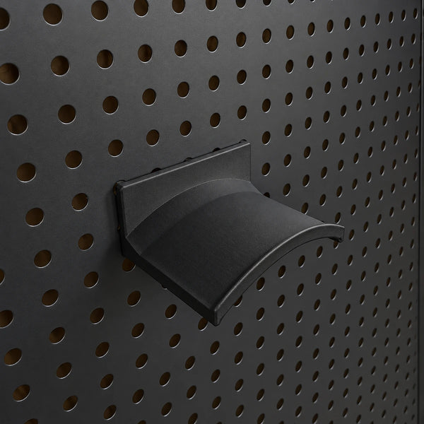 Black KOKO headset holder mounted on a black round-hole pegboard, showing the curved headband support.